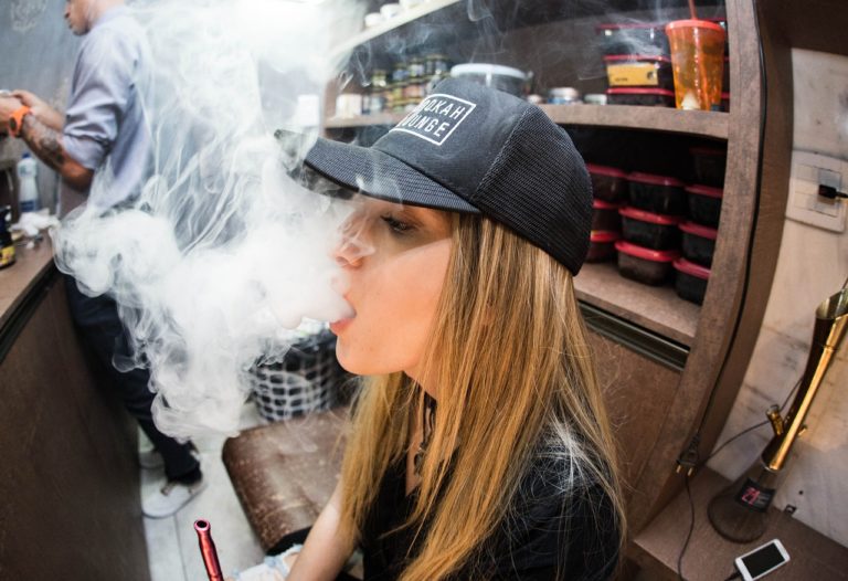 Woman Vaping Indoors Vaporizer Wire